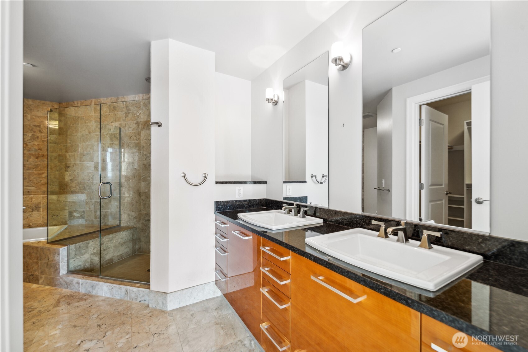 1920 4th Avenue, Unit 2301 Seattle, WA 98101 - Photo 15 of 40 a bathroom with a granite countertop sink and a mirror