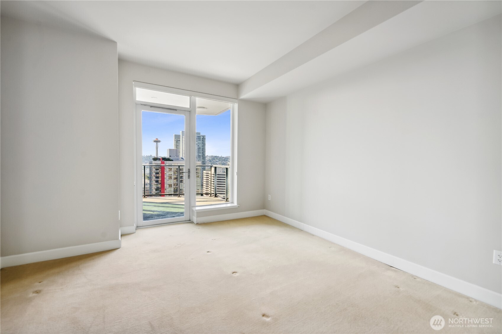 1920 4th Avenue, Unit 2301 Seattle, WA 98101 - Photo 18 of 40 an empty room with a fireplace and fan