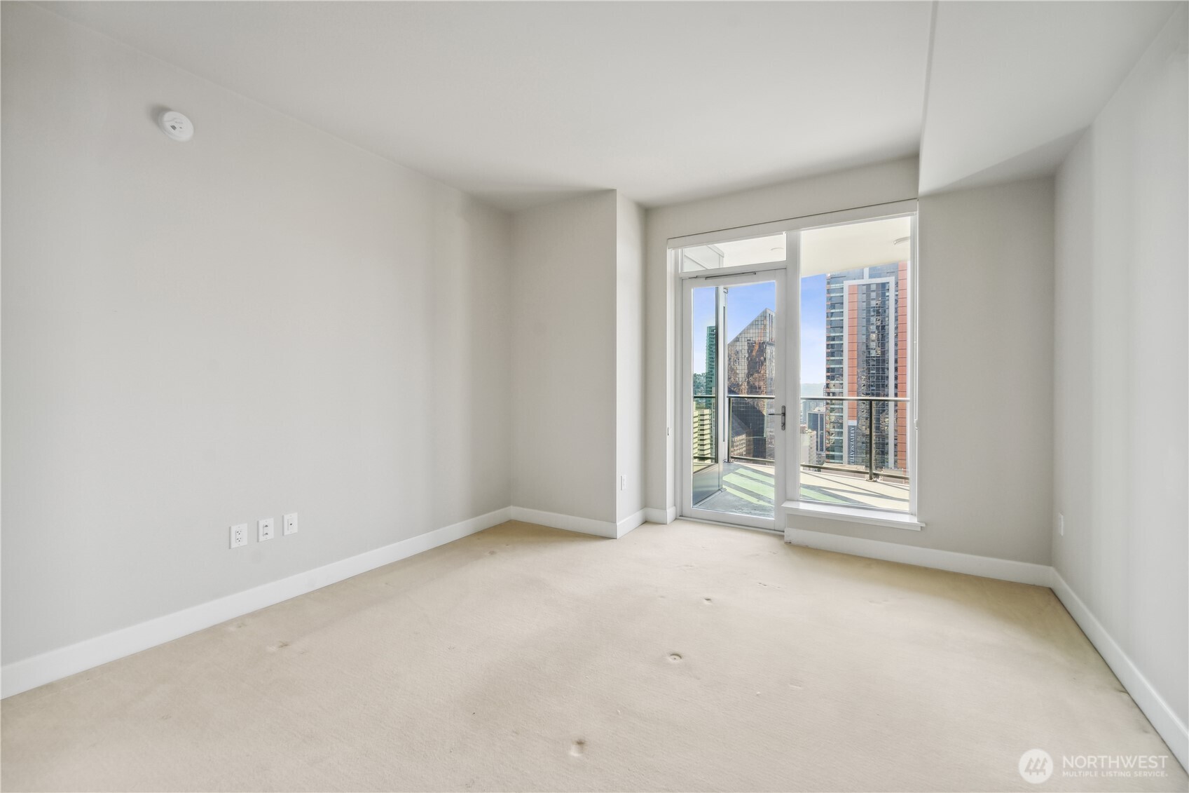 1920 4th Avenue, Unit 2301 Seattle, WA 98101 - Photo 19 of 40 a view of an empty room with a window