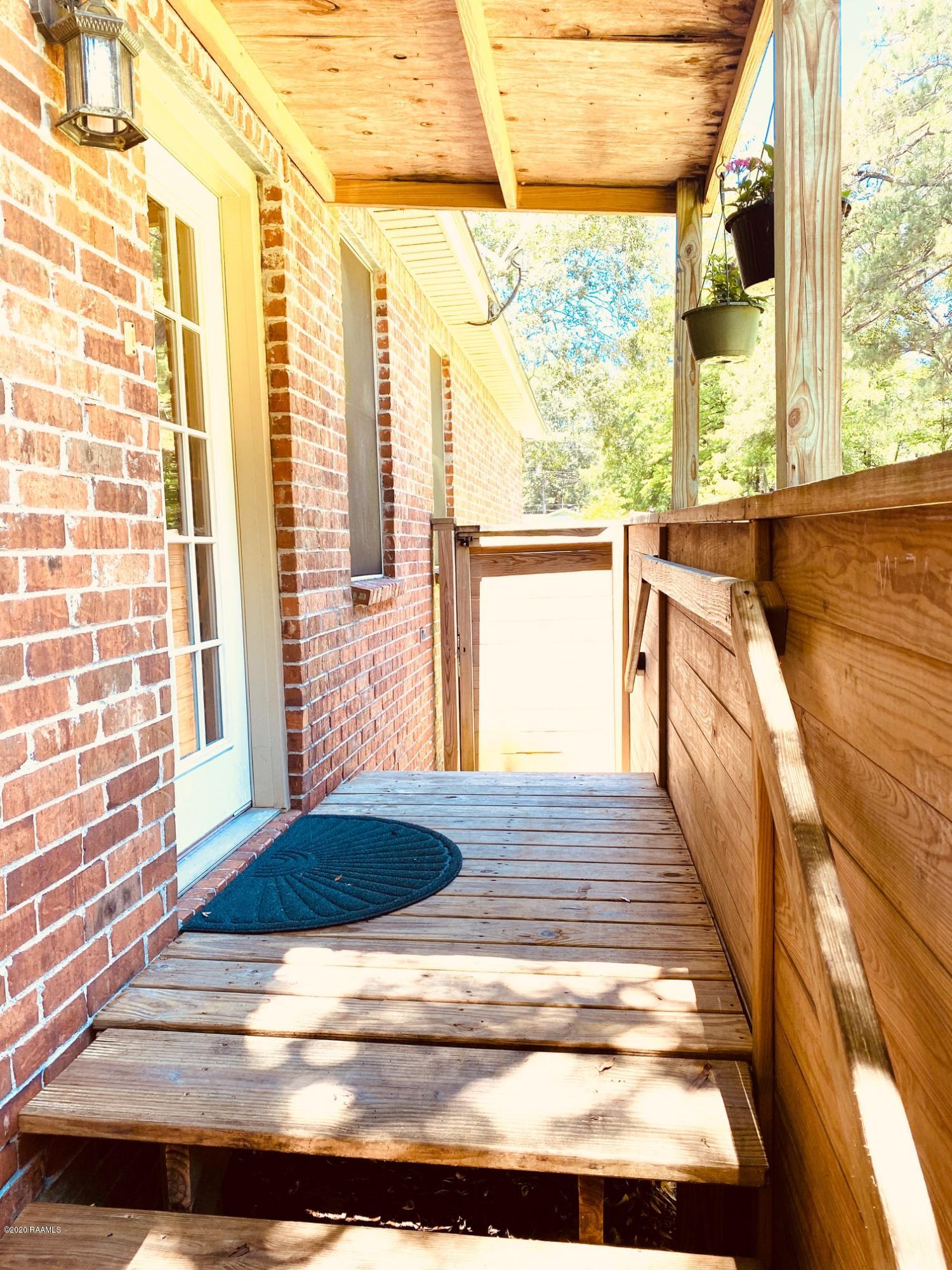 100 Attakapas Road Lafayette, LA 70501 - Photo 20 of 25 Backyard entrance to home