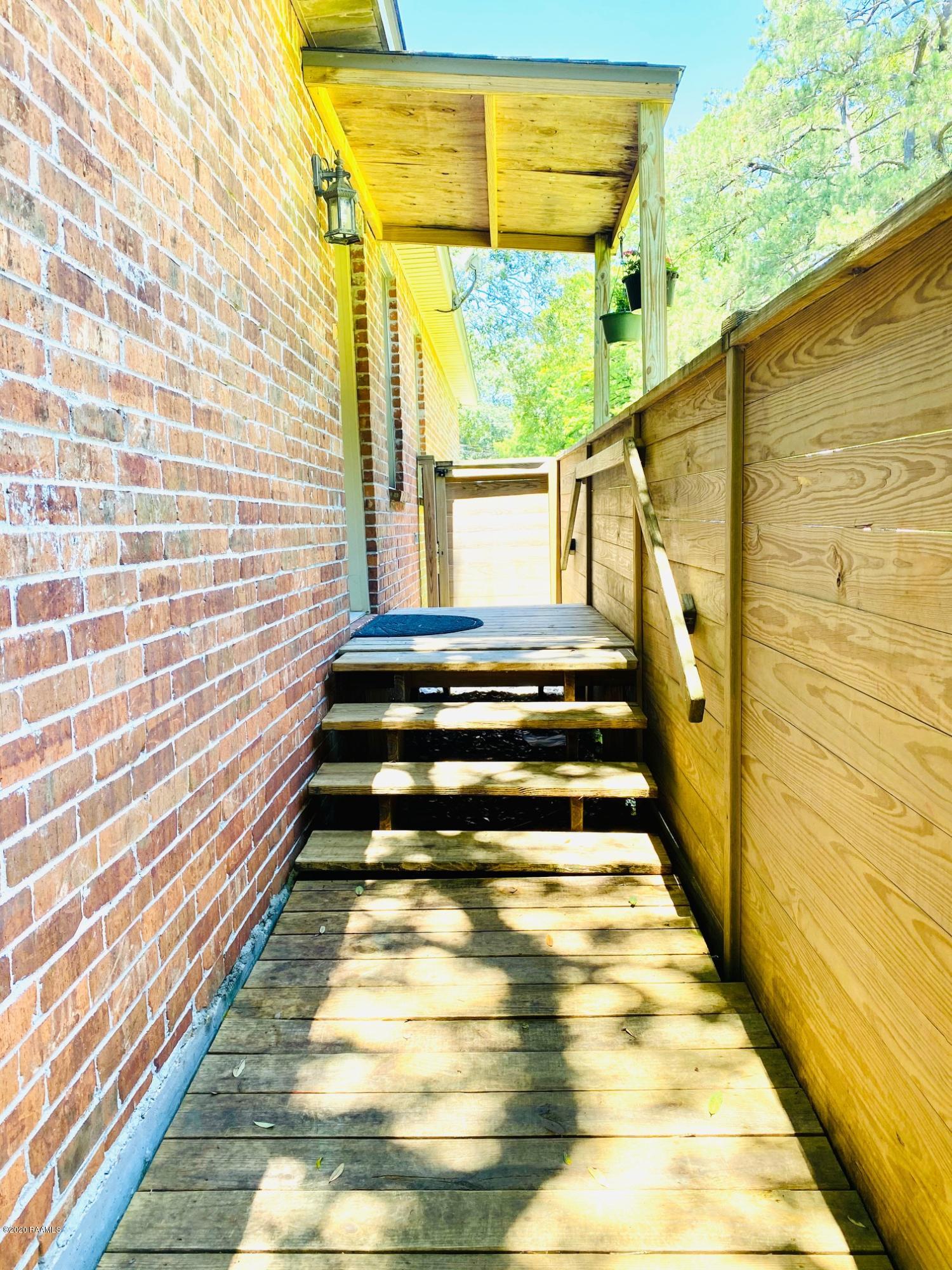 100 Attakapas Road Lafayette, LA 70501 - Photo 21 of 25 Backyard Entrance to home