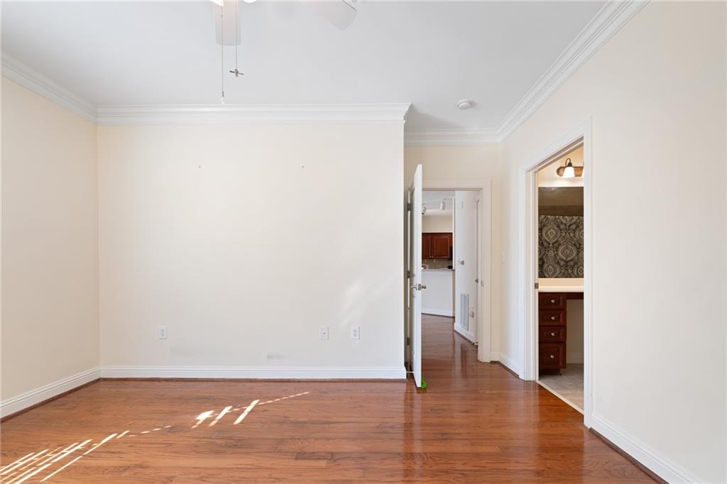 3309 Village Boulevard Southeast Rome, GA 30161 - Photo 19 of 38 a view of an empty room with wooden floor and a window