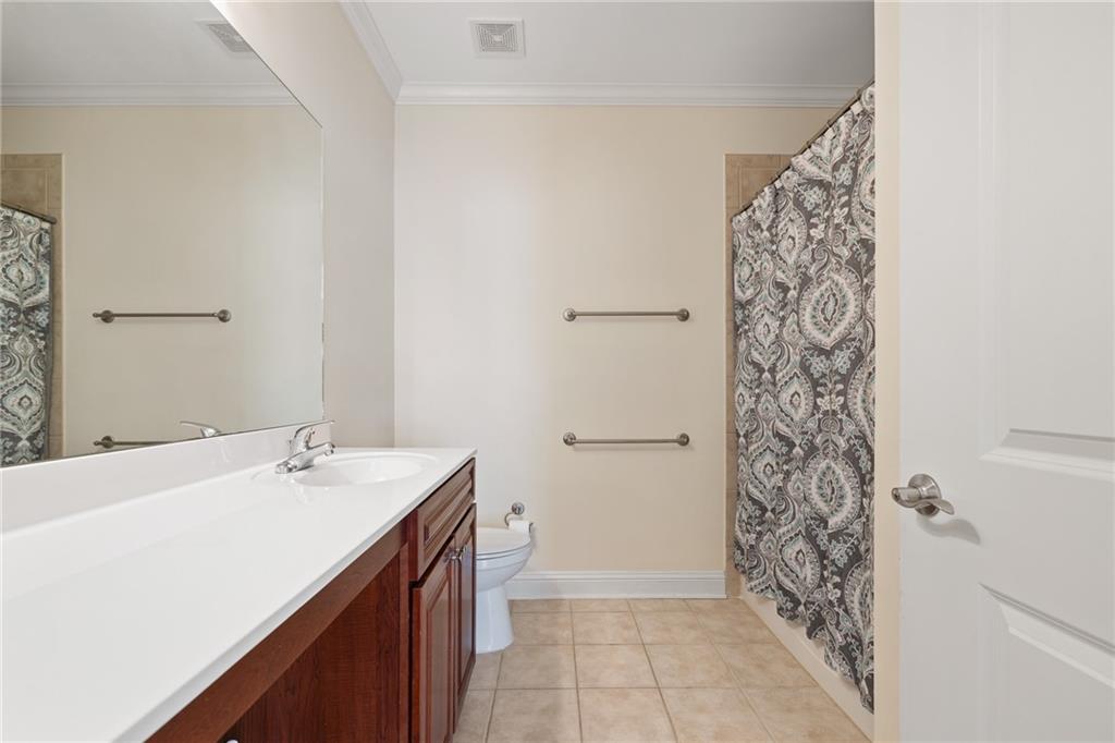 3309 Village Boulevard Southeast Rome, GA 30161 - Photo 20 of 38 a bathroom with a sink and a mirror