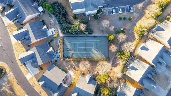 an aerial view of a house with a yard and potted plants