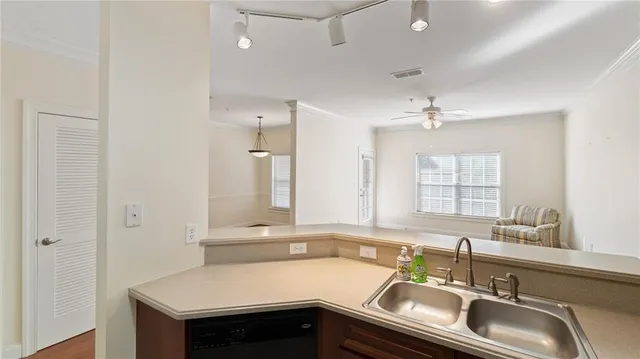 a kitchen with a sink and a window