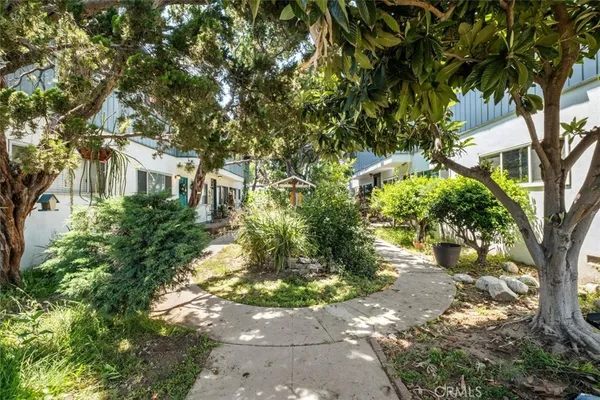 a backyard of a house with a tree