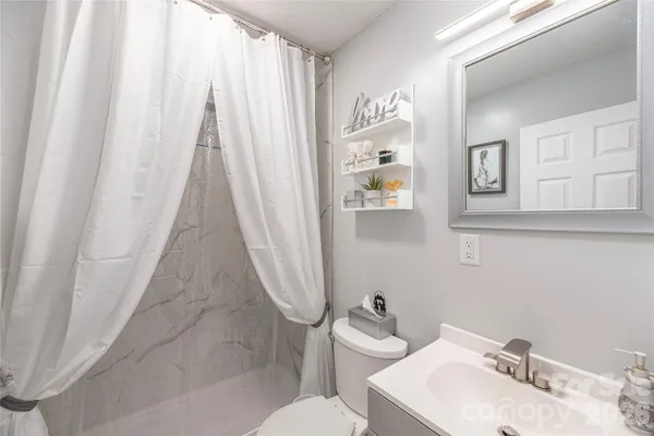 a bathroom with a sink and toilet
