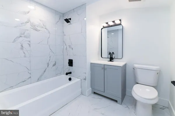 a bathroom with a sink and mirror