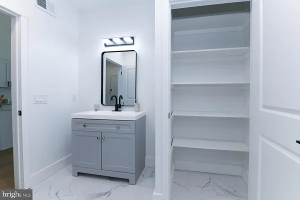 a bathroom with a toilet and shower