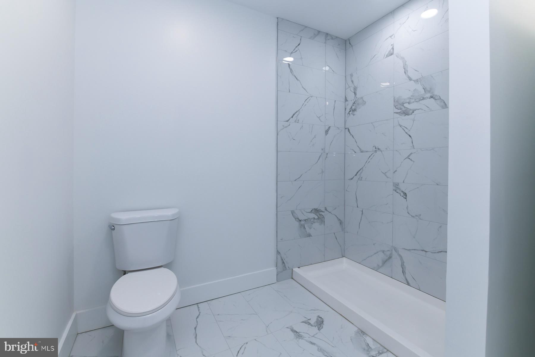 100 Aura Road, Unit 212 Clayton, NJ 08312 - Photo 17 of 19 a bathroom with a toilet and shower