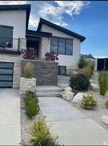 655 Oliver Road Tooele, UT 84074 - Photo 3 of 21 Modern architectural exterior featuring a striking design with contrasting white and charcoal finishes