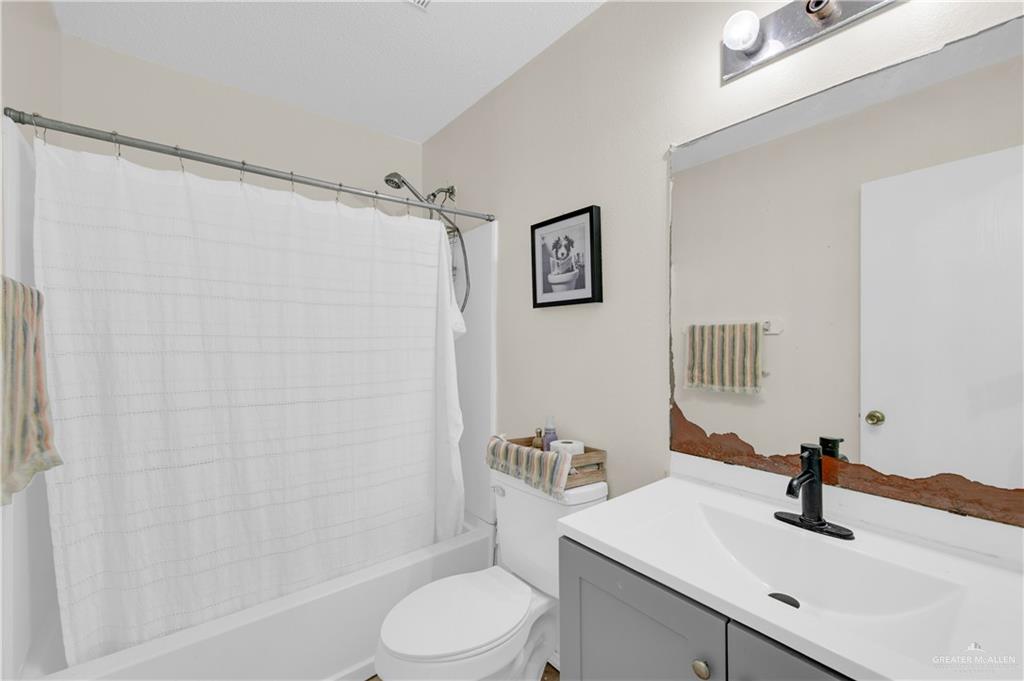 3301 Princeton Avenue McAllen, TX 78504 - Photo 13 of 21 a bathroom with a sink a toilet and shower