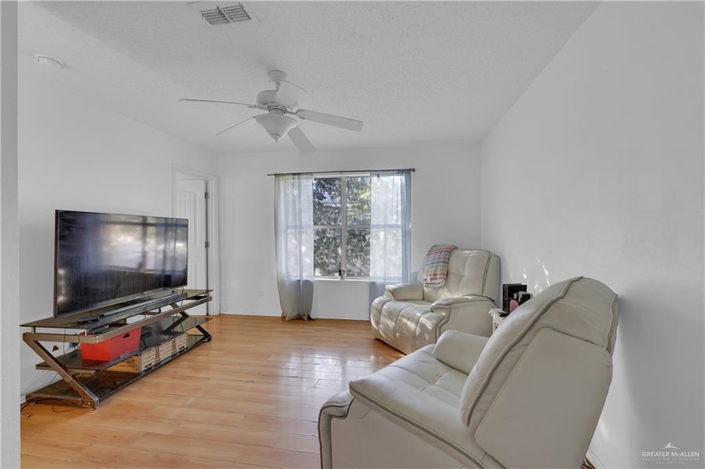 3301 Princeton Avenue McAllen, TX 78504 - Photo 19 of 21 a living room with furniture and a flat screen tv
