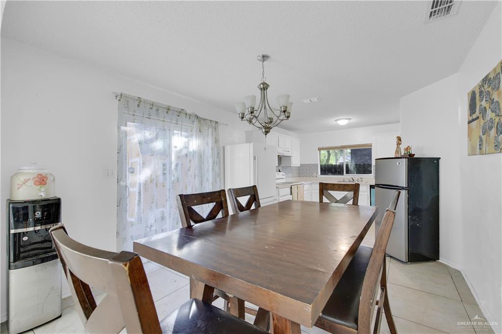 3301 Princeton Avenue McAllen, TX 78504 - Photo 9 of 21 a dining room with furniture and window