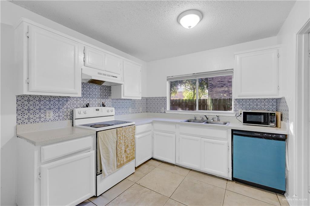 3301 Princeton Avenue McAllen, TX 78504 - Photo 10 of 21 a kitchen with a sink stove and cabinets