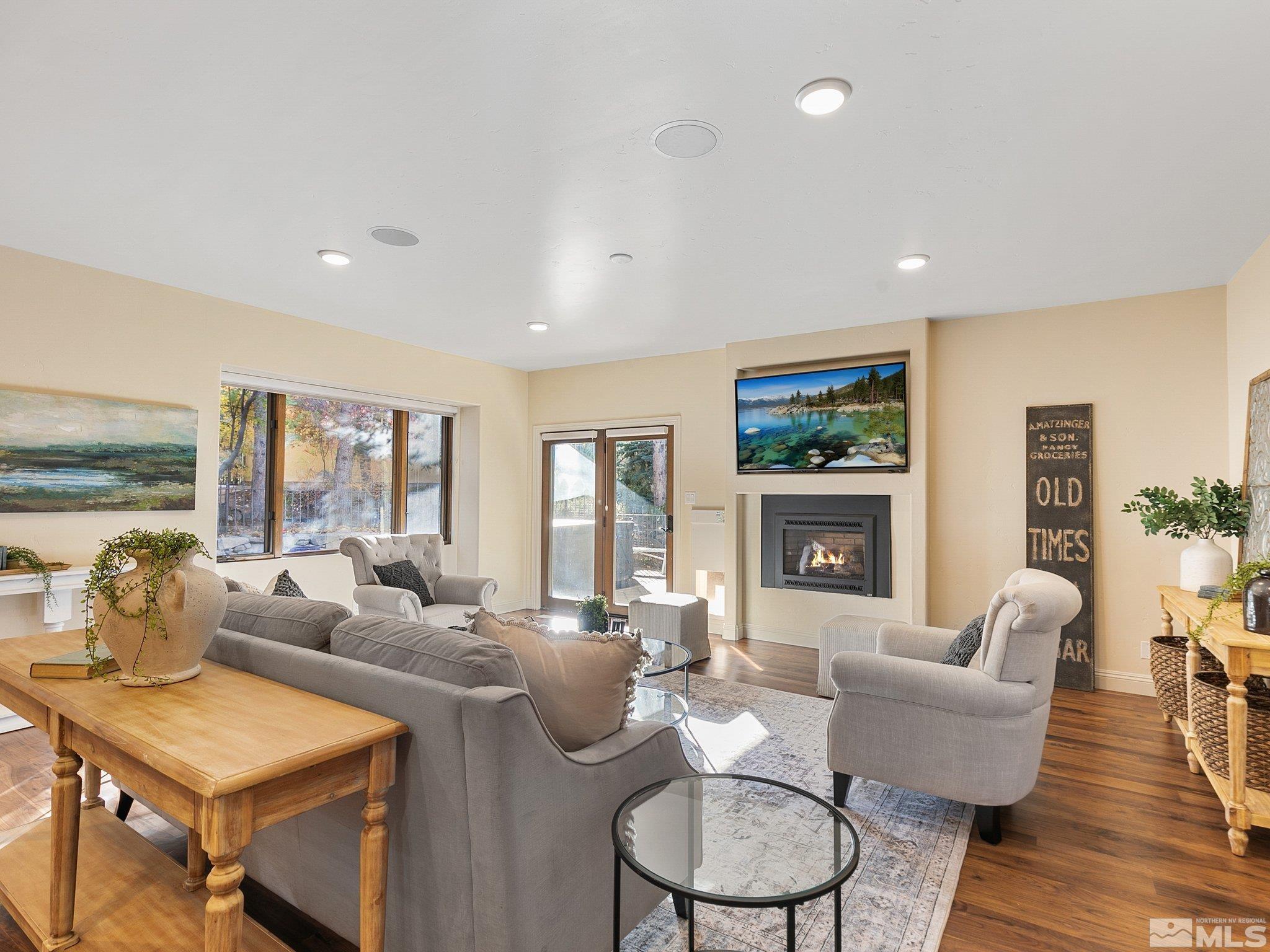 100 Sawbuck Road Reno, NV 89519 - Photo 11 of 40 a living room with fireplace furniture and a wooden floor