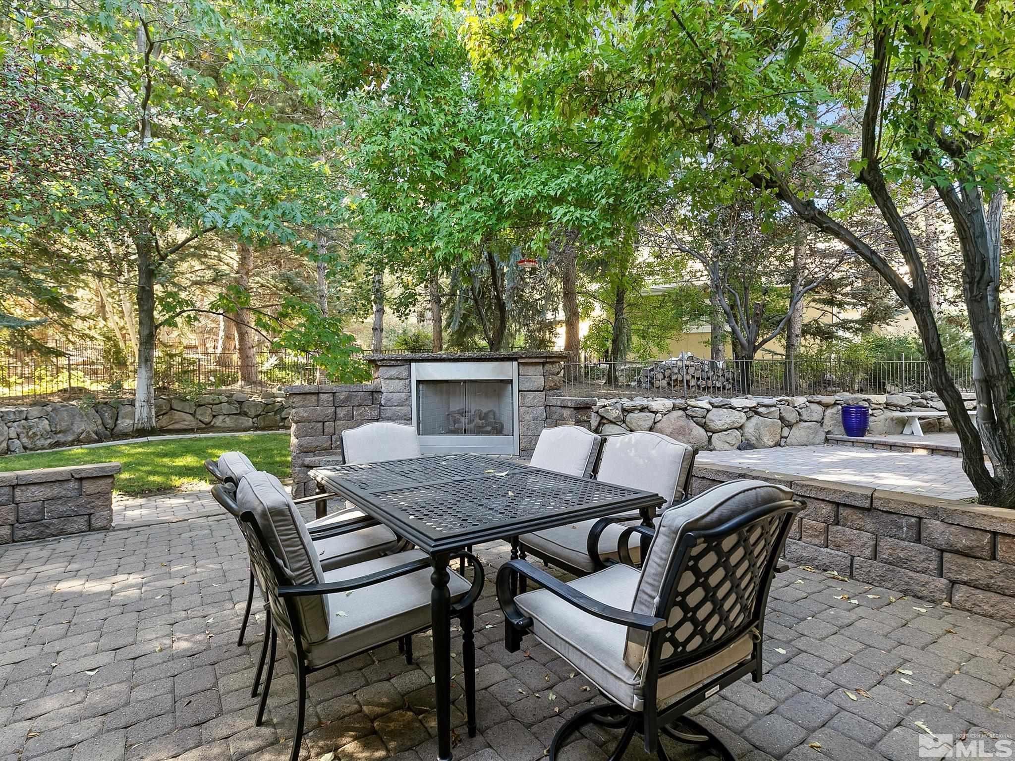 100 Sawbuck Road Reno, NV 89519 - Photo 13 of 40 a view of backyard with seating area and trees