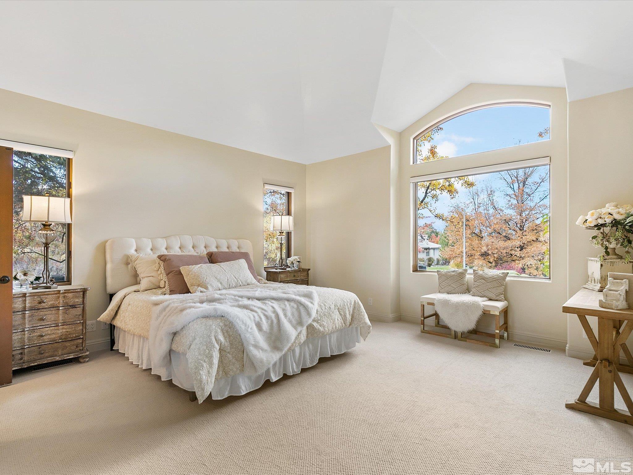 100 Sawbuck Road Reno, NV 89519 - Photo 19 of 40 a bedroom with bed and large window