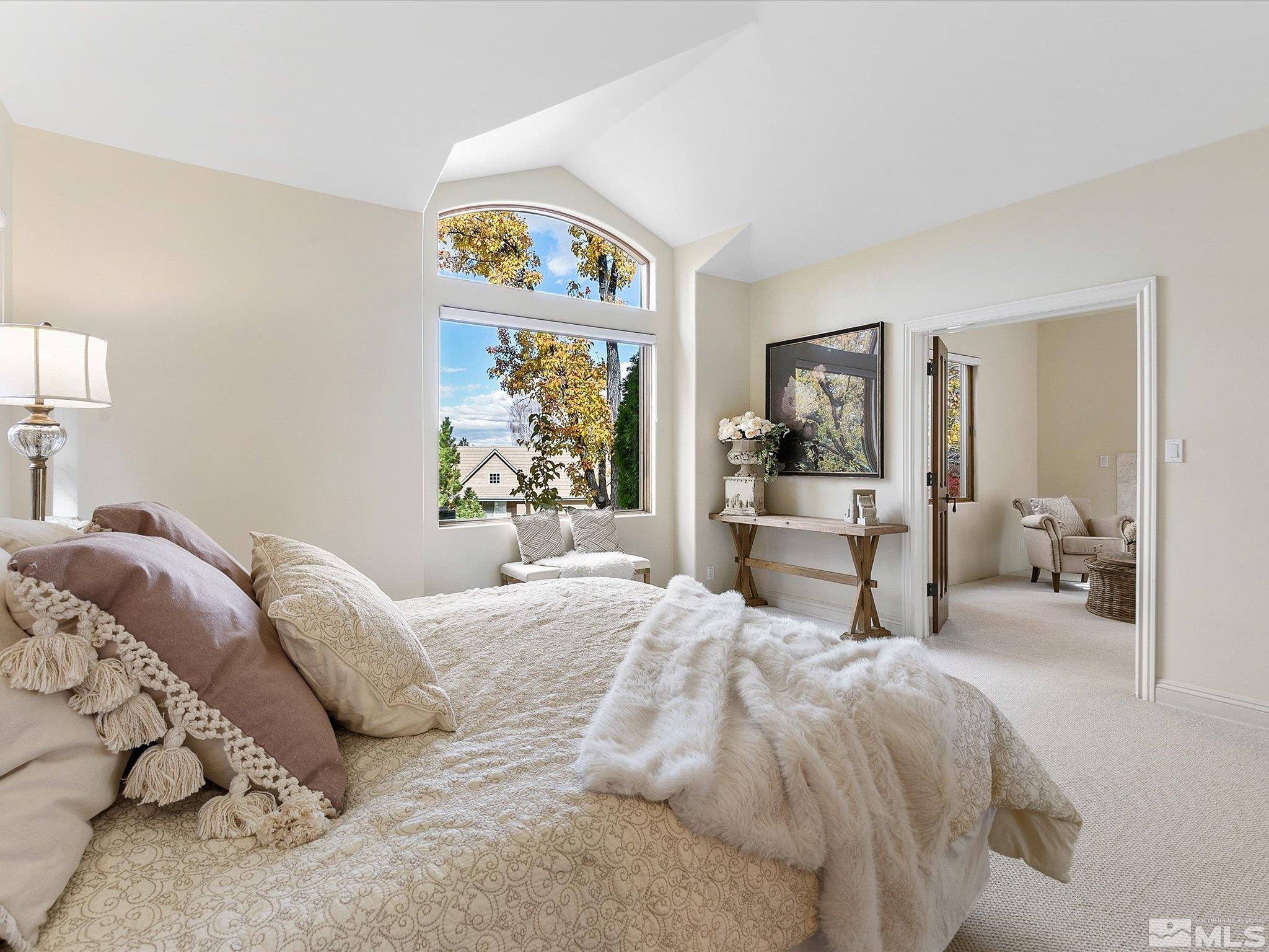 100 Sawbuck Road Reno, NV 89519 - Photo 20 of 40 a bedroom with a bed and a large mirror