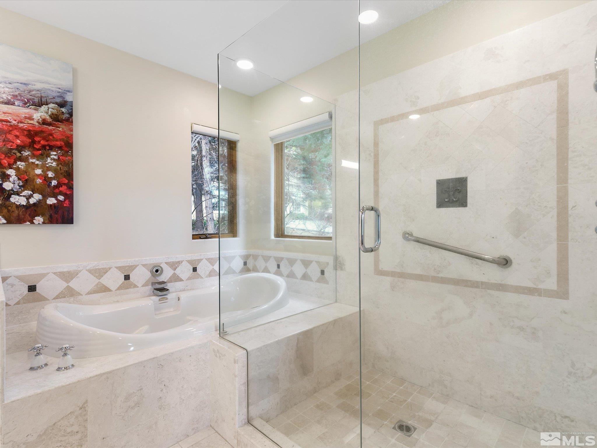 100 Sawbuck Road Reno, NV 89519 - Photo 23 of 40 a bathroom with a bathtub and a sink