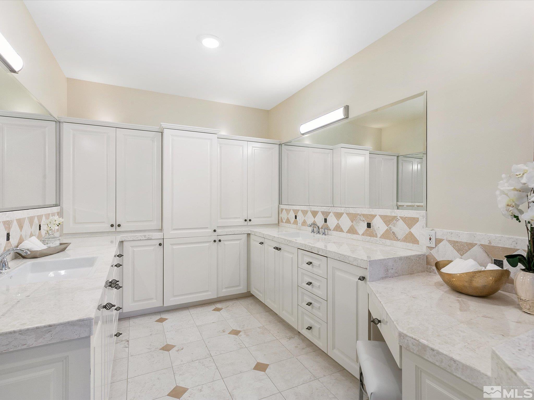 100 Sawbuck Road Reno, NV 89519 - Photo 24 of 40 a bathroom with a sink and a mirror