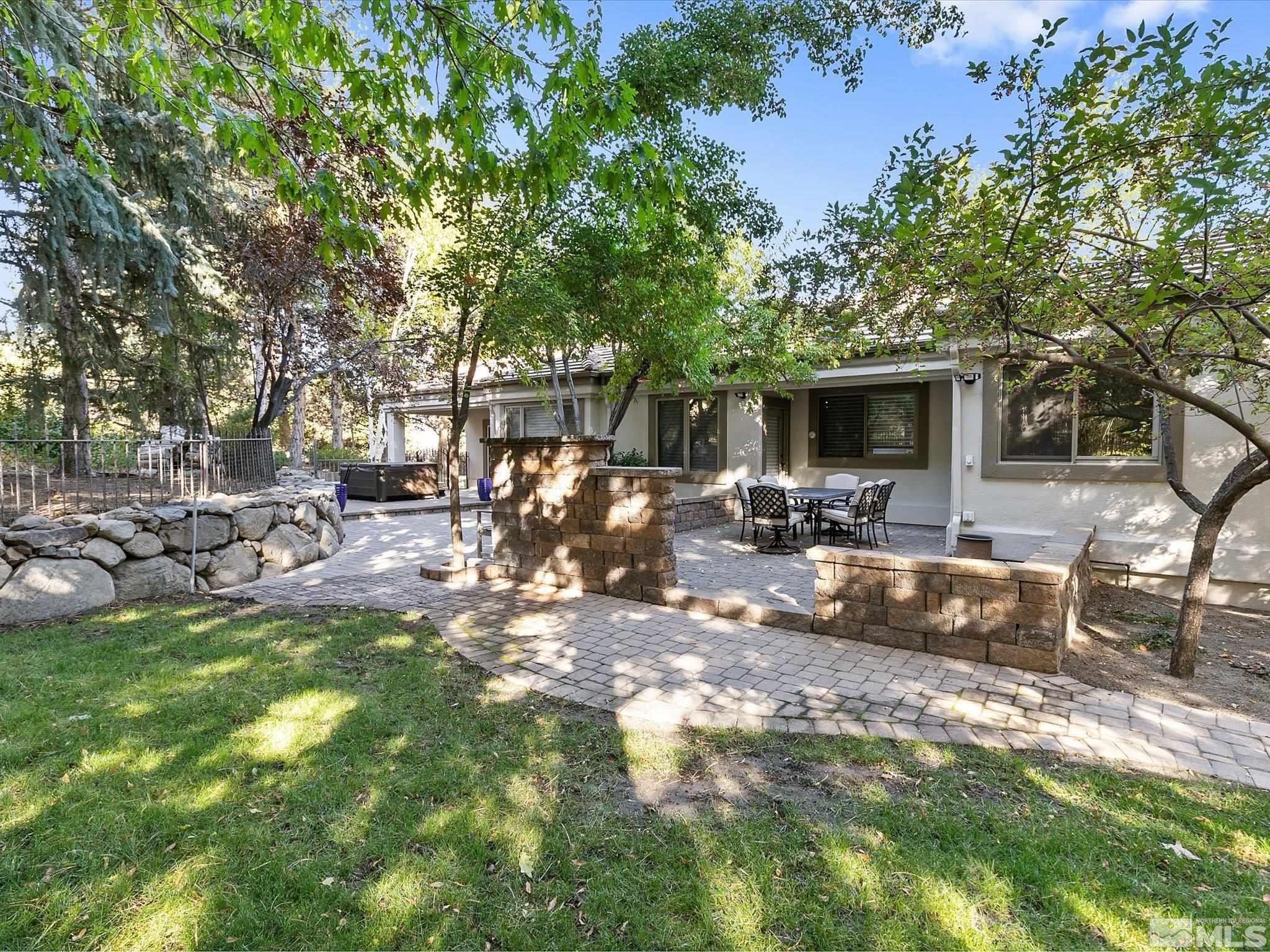 100 Sawbuck Road Reno, NV 89519 - Photo 35 of 40 a view of a backyard with a patio
