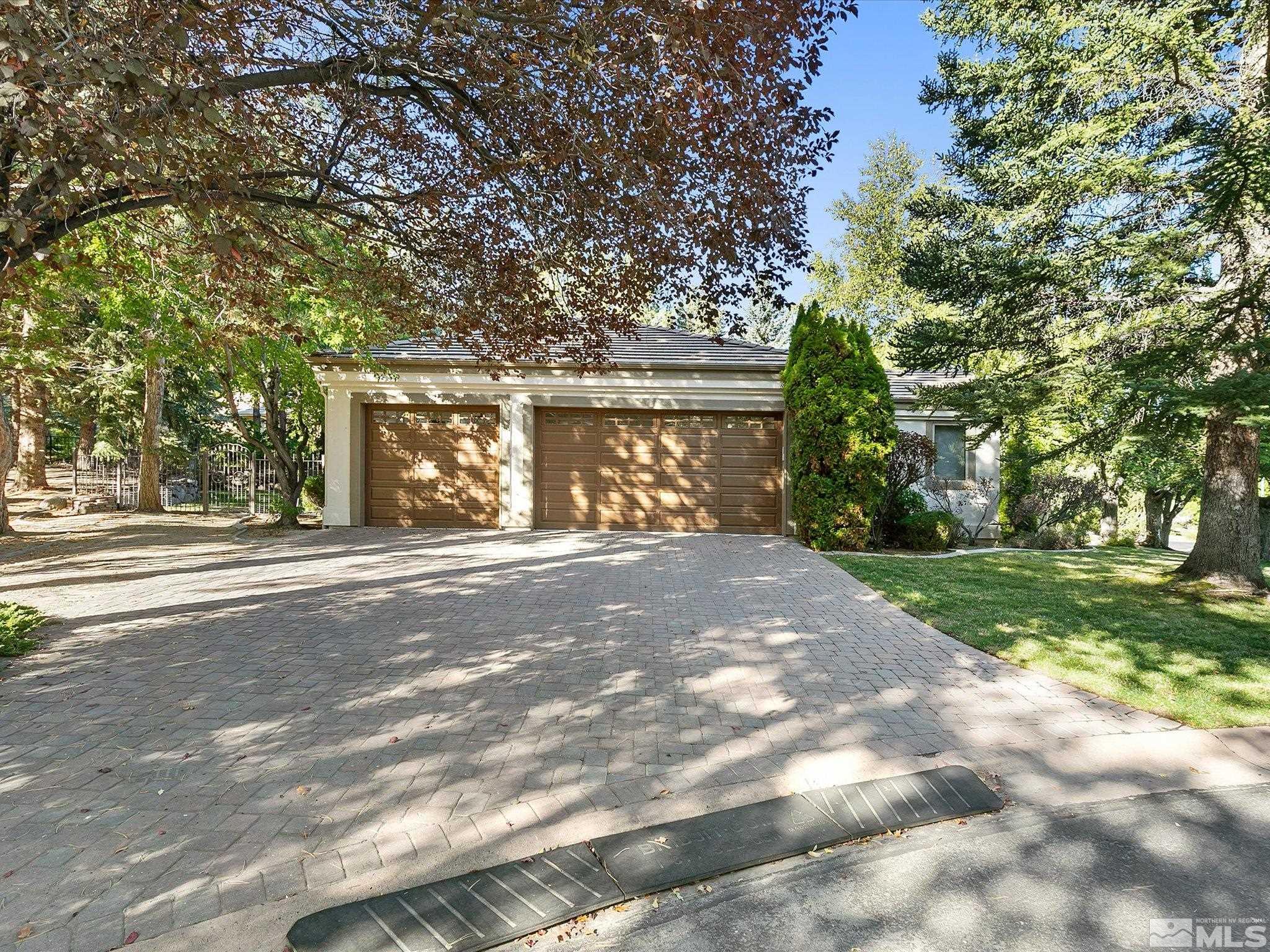 100 Sawbuck Road Reno, NV 89519 - Photo 38 of 40 a front view of a house with a yard