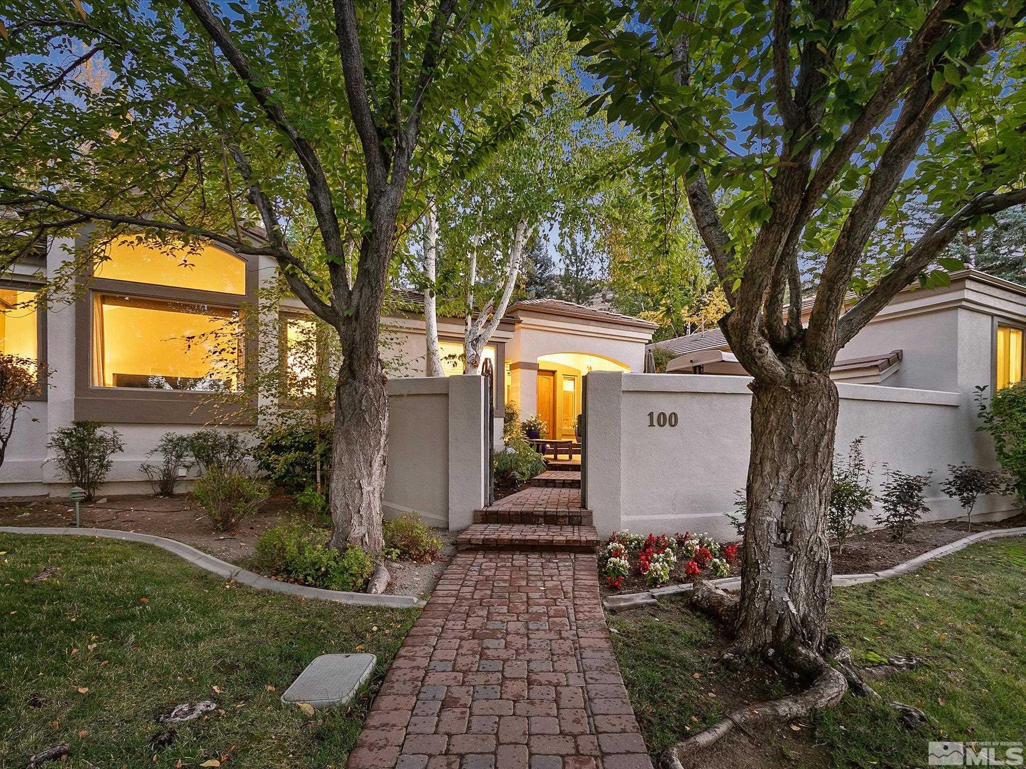 100 Sawbuck Road Reno, NV 89519 - Photo 4 of 40 a front view of a house with garden