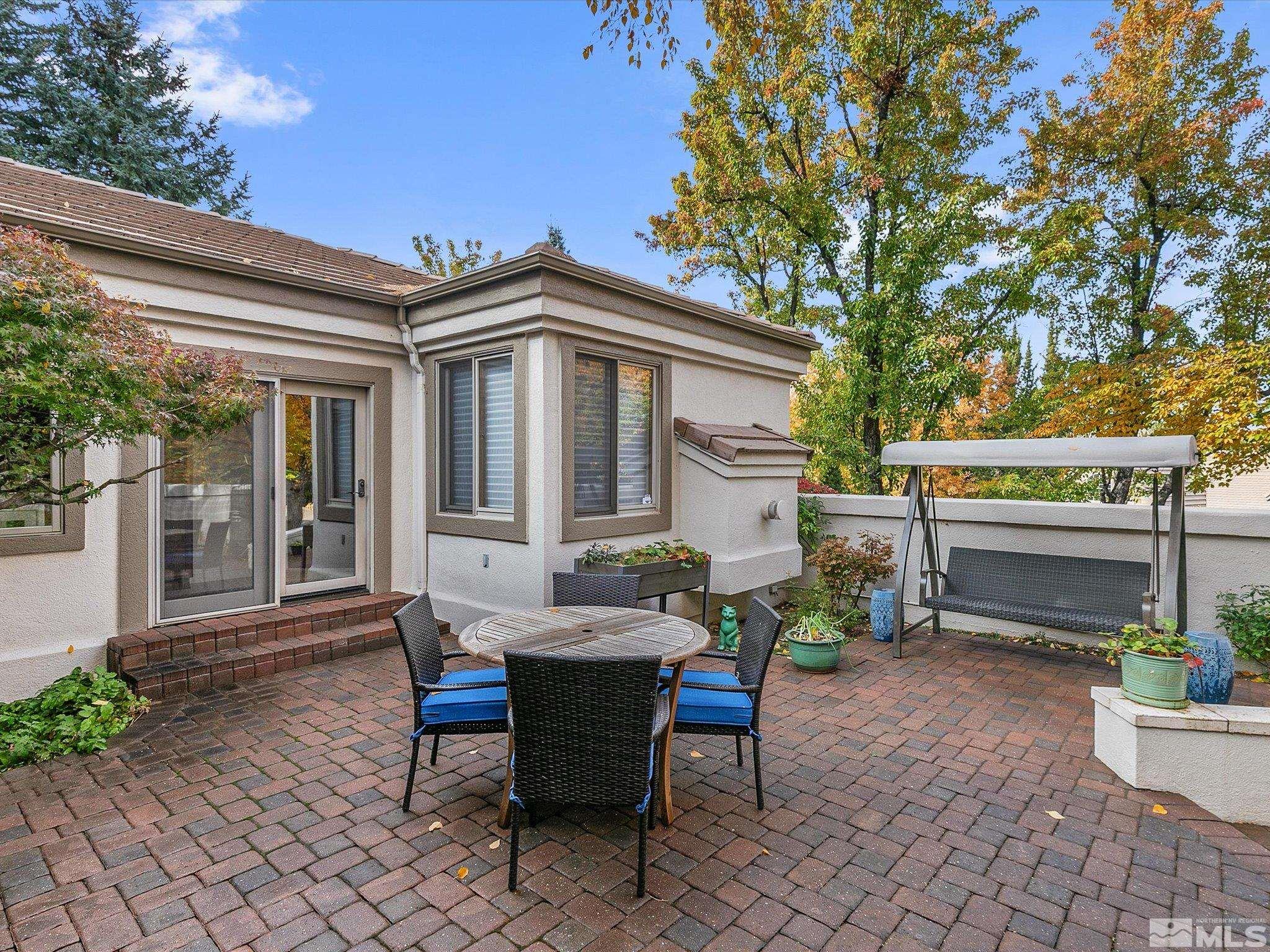 100 Sawbuck Road Reno, NV 89519 - Photo 6 of 40 a view of a house with backyard sitting area and garden