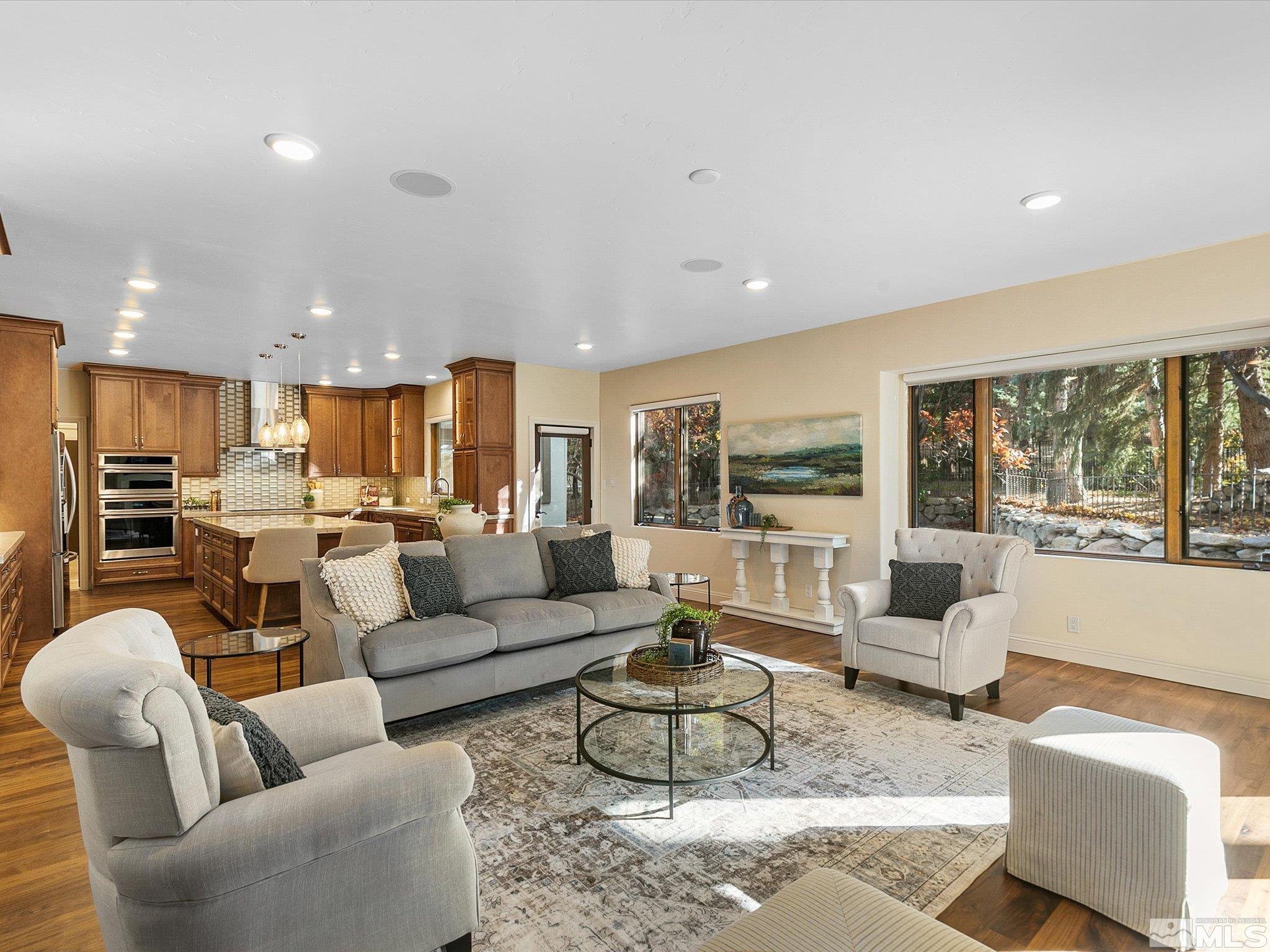 100 Sawbuck Road Reno, NV 89519 - Photo 8 of 40 a living room with furniture wooden floor and a large window