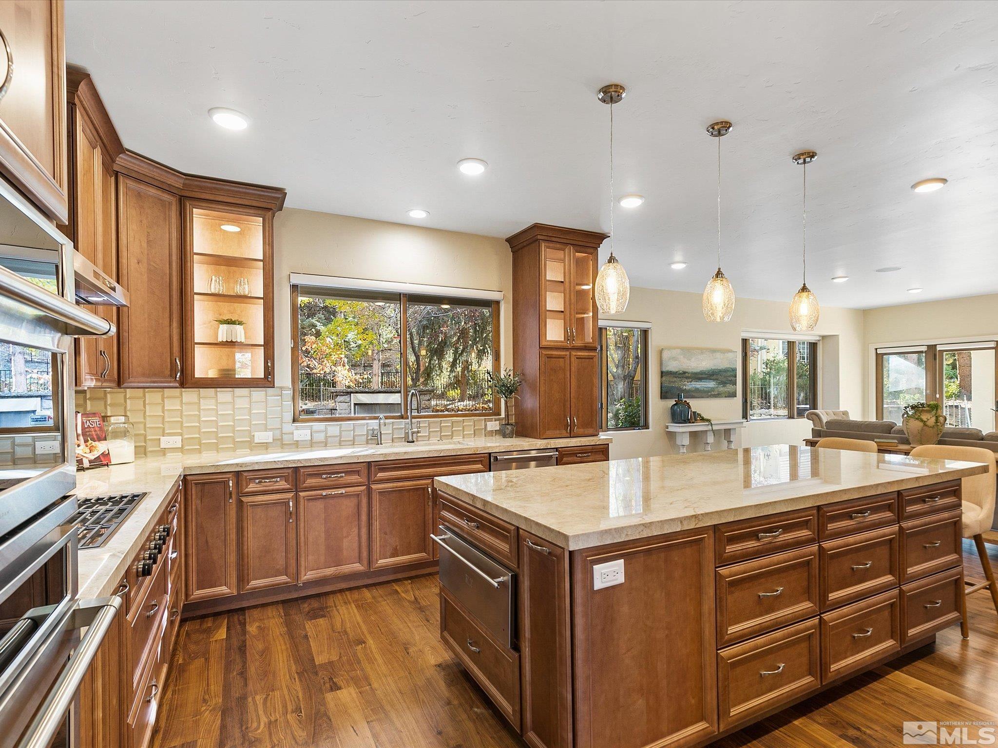 100 Sawbuck Road Reno, NV 89519 - Photo 10 of 40 a kitchen with a sink stove and cabinets