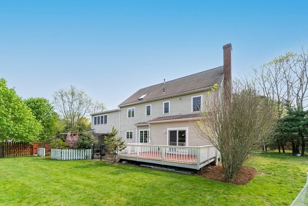 15 Dakin Road Sudbury, MA 01776 - Photo 26 of 42 a front view of a house with a garden and trees