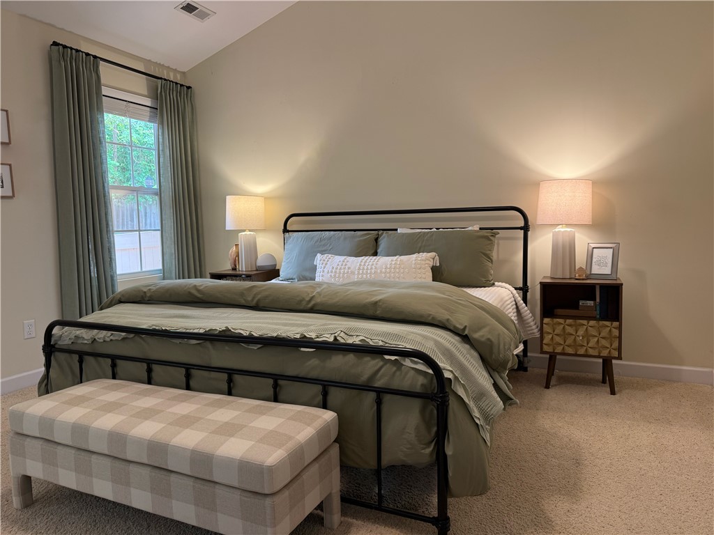 123 Abigail Lane Anderson, SC 29621 - Photo 8 of 22 Rest in a well-appointed room, featuring a pitched ceiling and ample natural light.