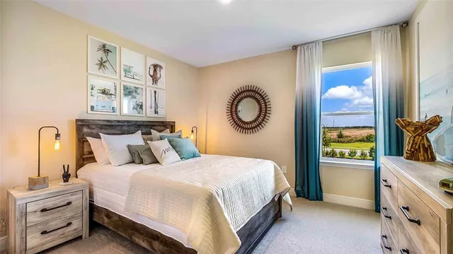 a bedroom with a bed and a chandelier