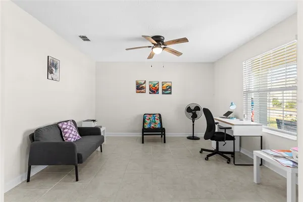 a living room with furniture and a window