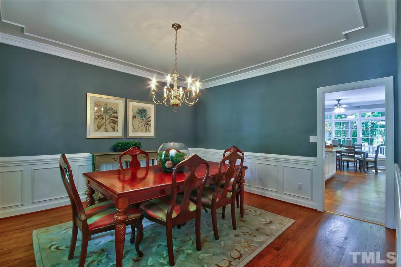 6108 Fetlock Drive Raleigh, NC 27613 - Photo 12 of 25 a view of a dining room with furniture wooden floor and a chandelier