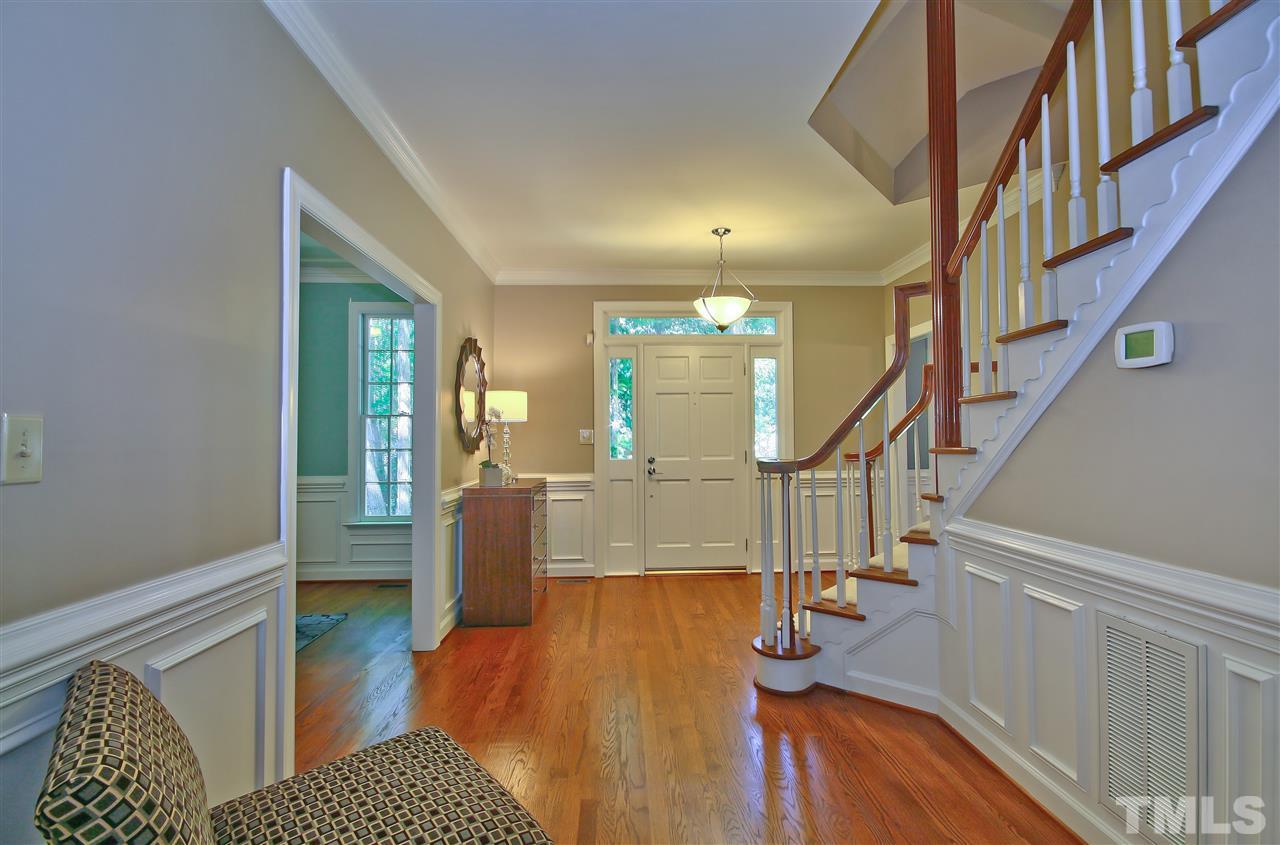 6108 Fetlock Drive Raleigh, NC 27613 - Photo 3 of 25 a living room with furniture and a dining table with wooden floor