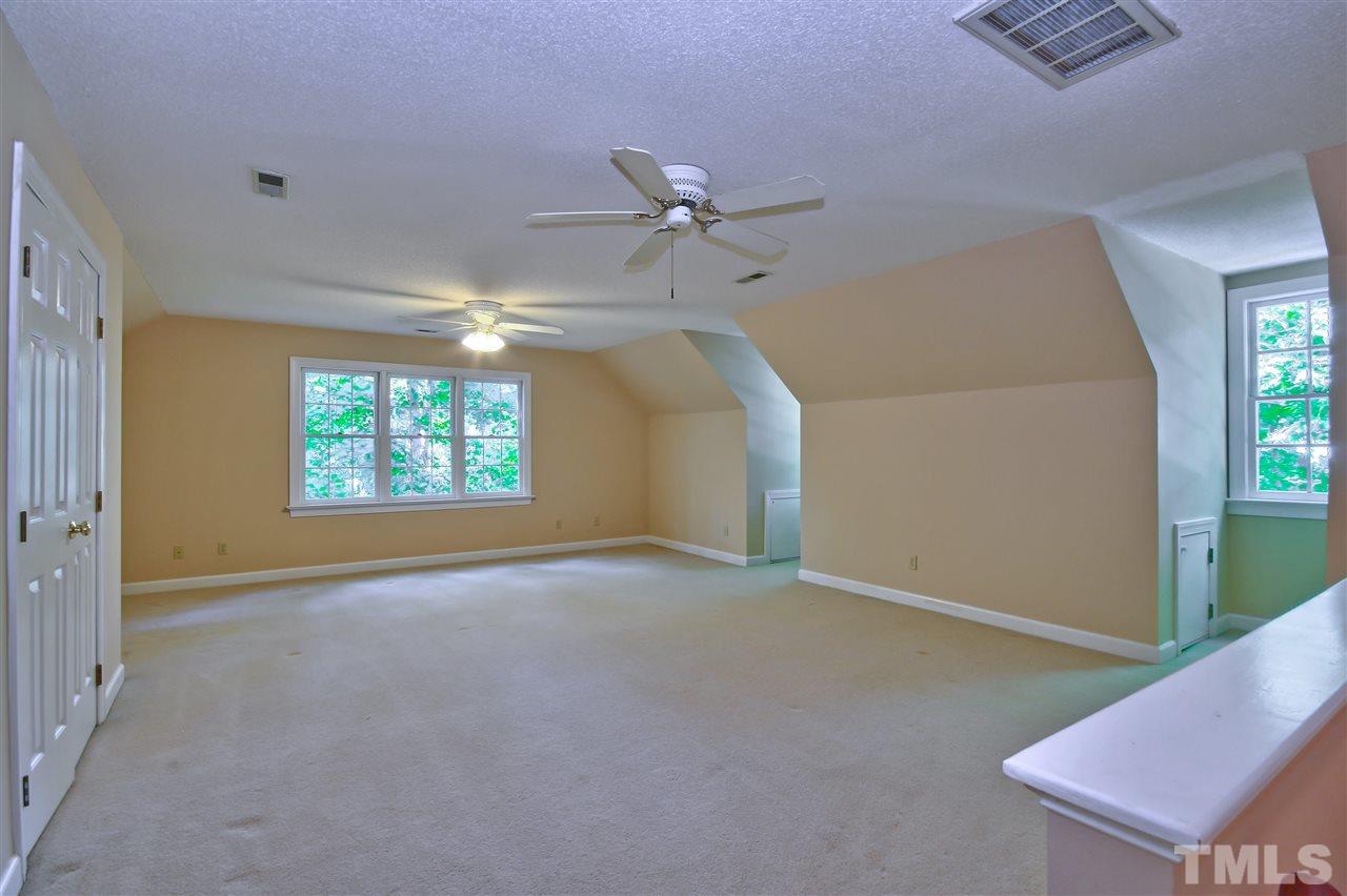 6108 Fetlock Drive Raleigh, NC 27613 - Photo 22 of 25 an empty room with windows and fan