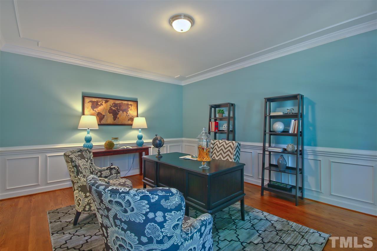 6108 Fetlock Drive Raleigh, NC 27613 - Photo 4 of 25 a living room with furniture and a flat screen tv