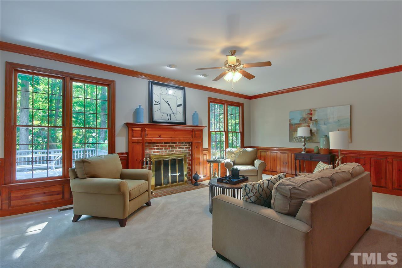 6108 Fetlock Drive Raleigh, NC 27613 - Photo 6 of 25 a living room with furniture and a fireplace