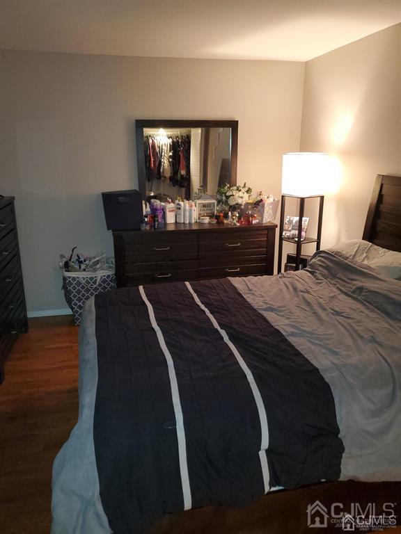 18 Judson Street, Unit 3A Edison, NJ 08837 - Photo 6 of 13 a bedroom with a bed and a mirror