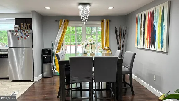 a view of a dining room with furniture and a window