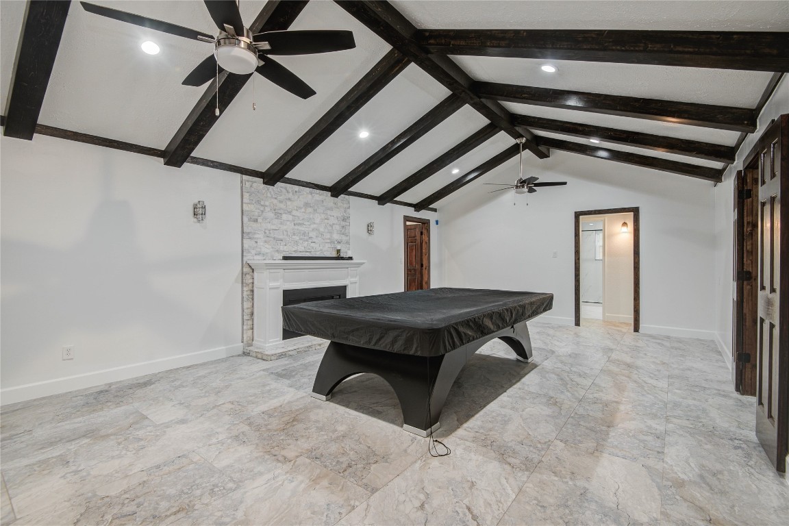 25910 Maplewood Drive Spring, TX 77386 - Photo 13 of 50 a bedroom with a bed and a chandelier