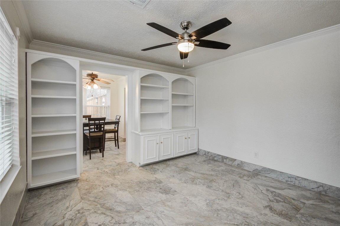 25910 Maplewood Drive Spring, TX 77386 - Photo 21 of 50 a view of an empty room and a ceiling fan