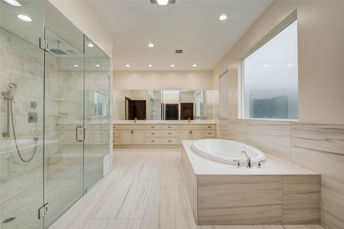 25910 Maplewood Drive Spring, TX 77386 - Photo 24 of 50 a bathroom with a bathtub and a sink