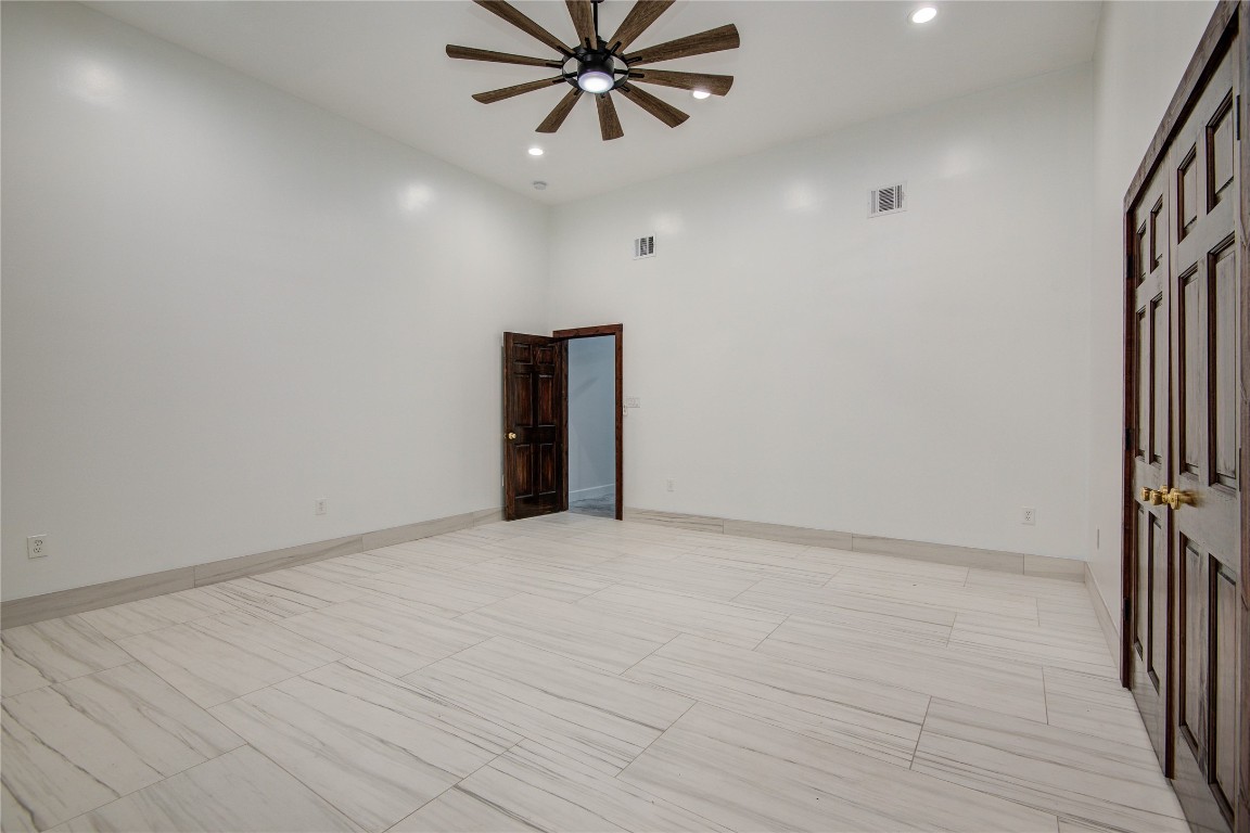 25910 Maplewood Drive Spring, TX 77386 - Photo 32 of 50 en empty room with ceiling fan and window