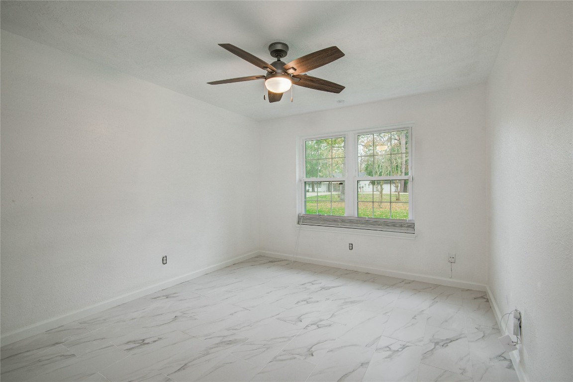 25910 Maplewood Drive Spring, TX 77386 - Photo 33 of 50 a view of an empty room with a window