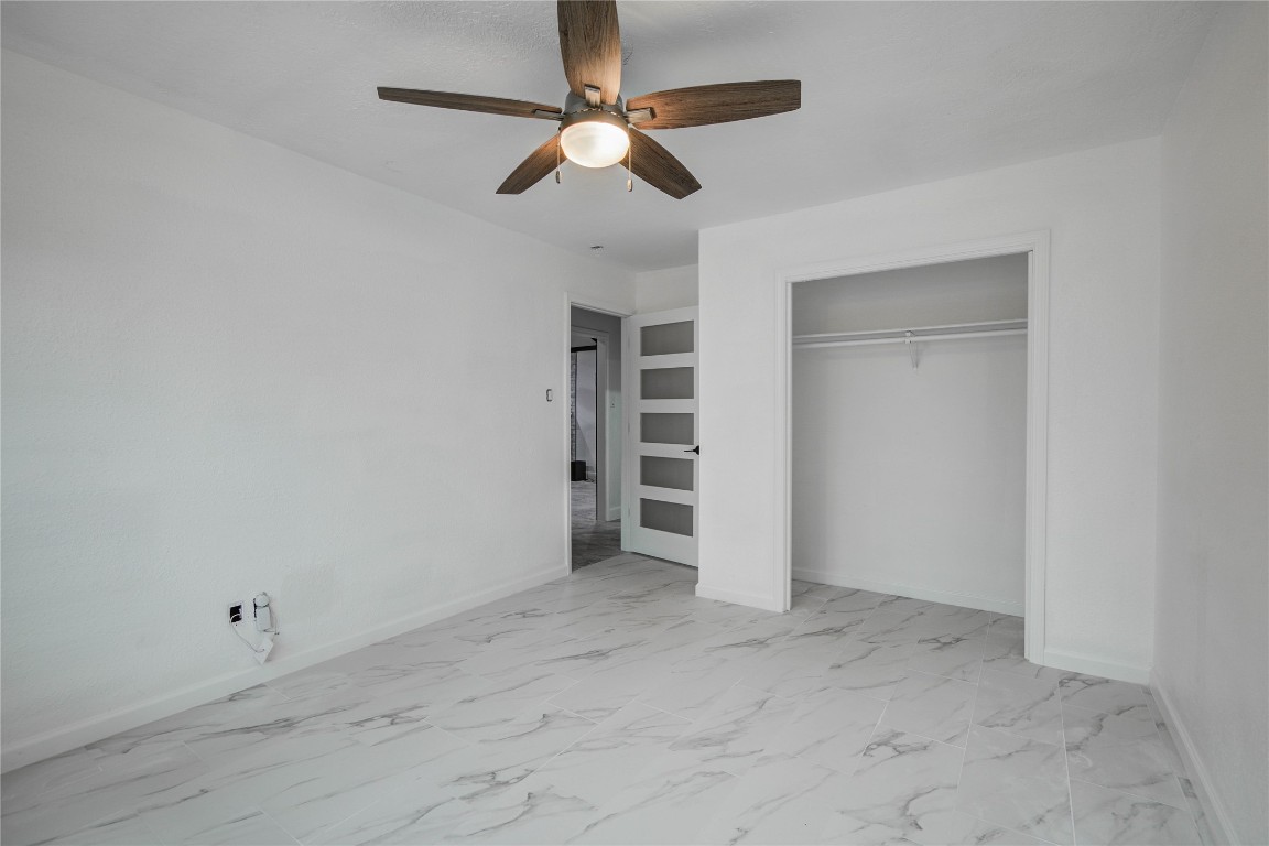 25910 Maplewood Drive Spring, TX 77386 - Photo 34 of 50 an empty room with closet and ceiling fan