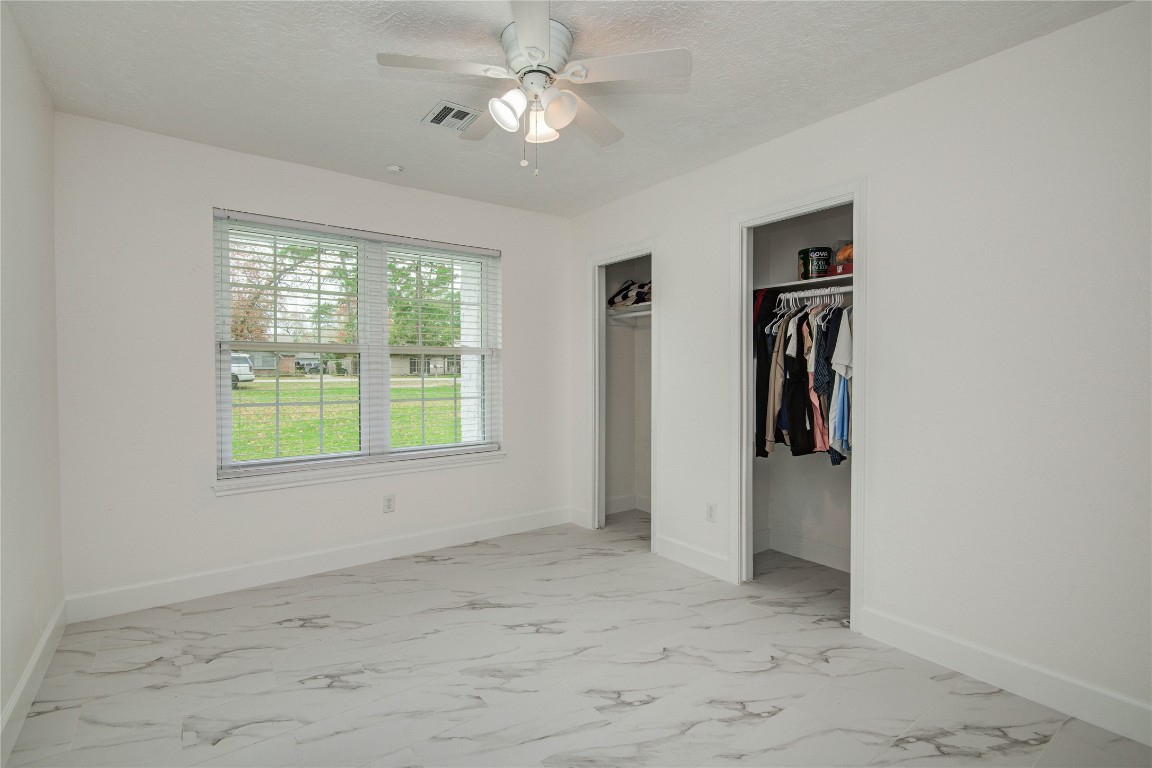 25910 Maplewood Drive Spring, TX 77386 - Photo 36 of 50 a view of a room with a ceiling fan and window