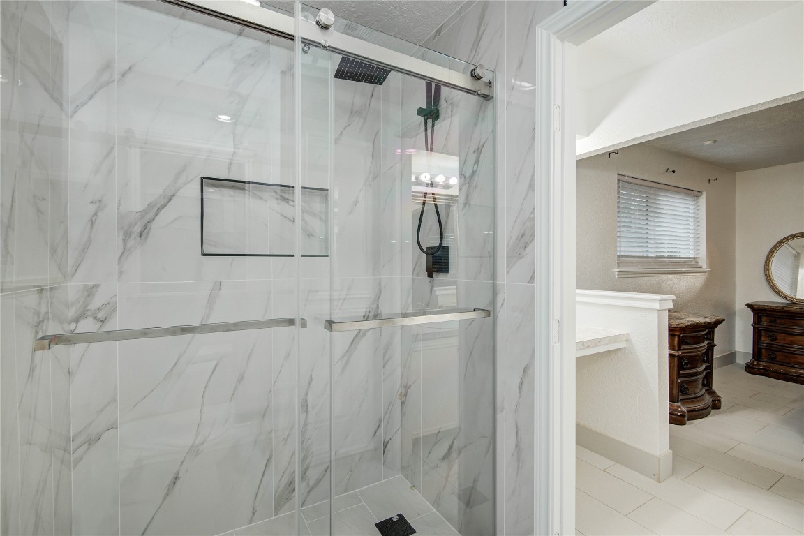 25910 Maplewood Drive Spring, TX 77386 - Photo 37 of 50 a bathroom with a shower and a mirror